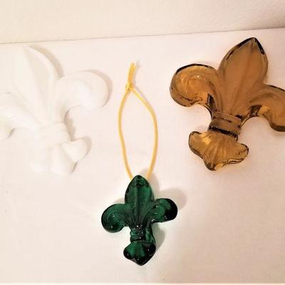 Lot #99  Three Studio glass Fleur di Lis ornaments from Studio Inferno