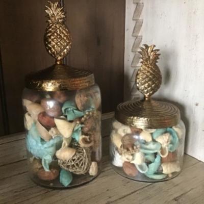 TWO BRASS COLORED PINEAPPLE TOPPED GLASS SHELL CONTAINERS