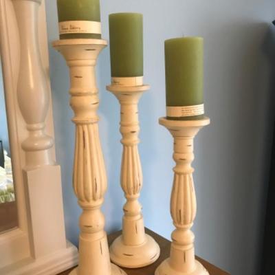 THREE WOODEN CANDLESTICK HOLDERS WITH NEW CANDLES