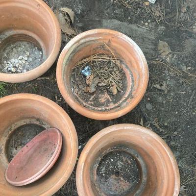 Lot S18: Set of four terra-cotta planters