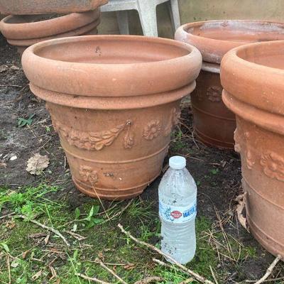 Lot S18: Set of four terra-cotta planters