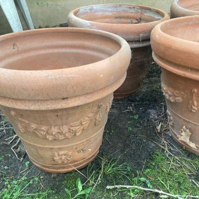 Lot S18: Set of four terra-cotta planters