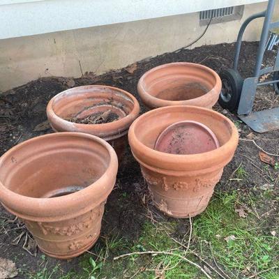 Lot S18: Set of four terra-cotta planters