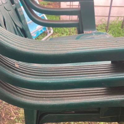 Lot S24: Three plastic outdoor chairs