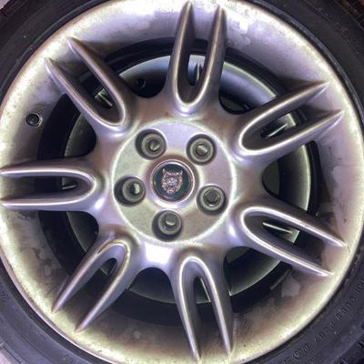 Lot S4: Set of four tires/rims for a Jaguar