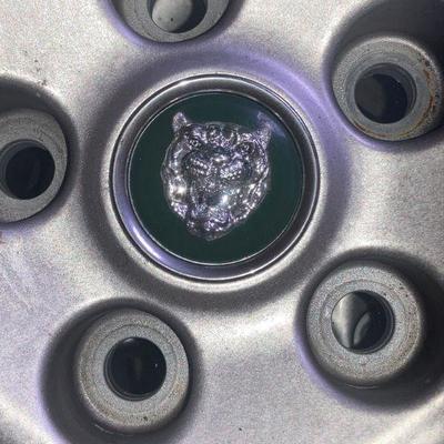 Lot S4: Set of four tires/rims for a Jaguar
