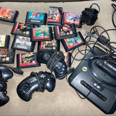 Lot B24: Sega Genesis Console Controllers and Games