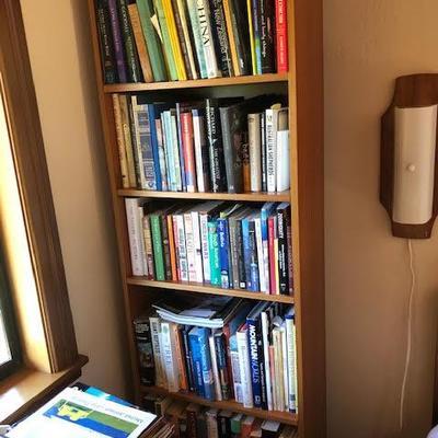 Tall Bookshelf with Assorted Books