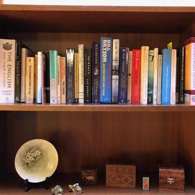 Tall Bookshelf with Assorted Books and Decor Items