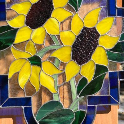 Vibrant Sunflowers and Blue Edged Stained Glass Window