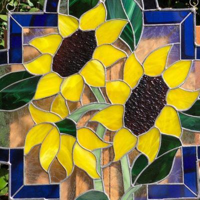 Vibrant Sunflowers and Blue Edged Stained Glass Window