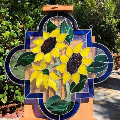 Vibrant Sunflowers and Blue Edged Stained Glass Window