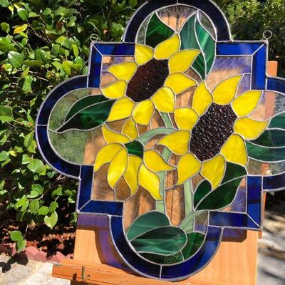 Vibrant Sunflowers and Blue Edged Stained Glass Window