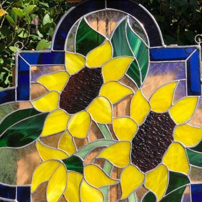 Vibrant Sunflowers and Blue Edged Stained Glass Window