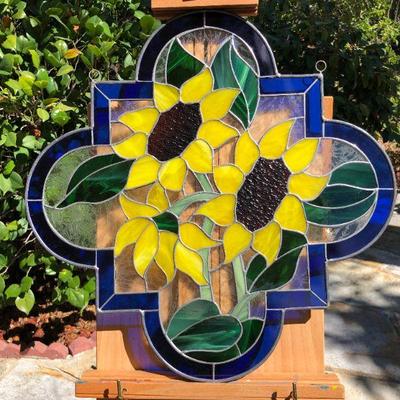 Vibrant Sunflowers and Blue Edged Stained Glass Window