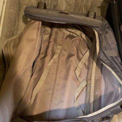 18. Rolling Duffle Bag and Swiss Army Suitcase.