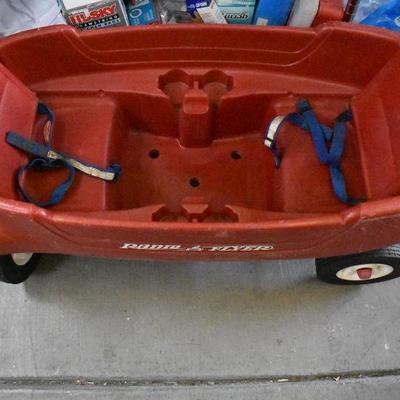 Radio Flyer Plastic Wagon with fold down seats. Front wheels need aligning