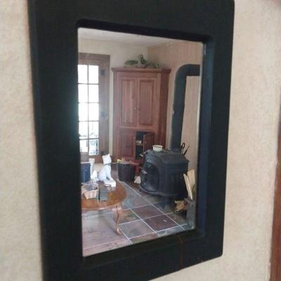 Black framed wall mirror