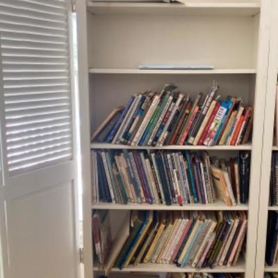Lot # 935 Large White Bi-Fold Door Bookshelf with Art Books 