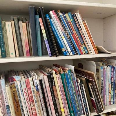 Lot #936 Large White Bi-Fold Door Bookshelf with Books 