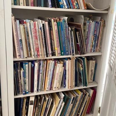 Lot #936 Large White Bi-Fold Door Bookshelf with Books 