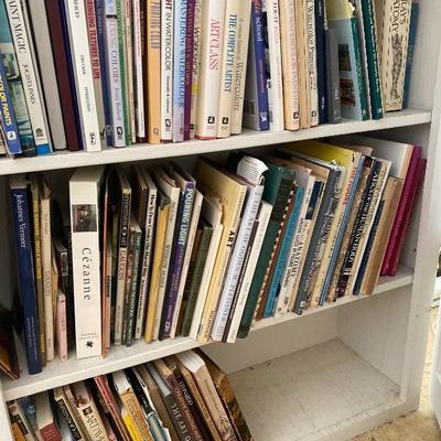 Lot #936 Large White Bi-Fold Door Bookshelf with Books 