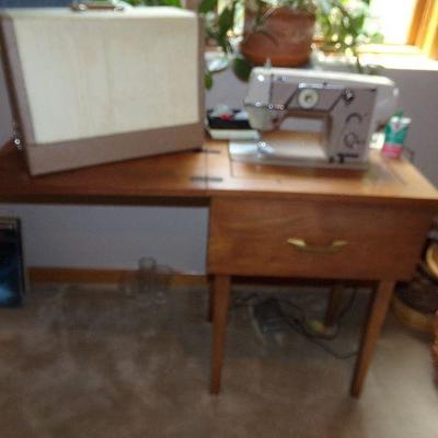 LOT 13  SEWING MACHINE AND CABINET