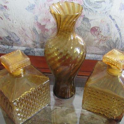 Lot 26- Two Vintage Amber Bottles W/Topper and Vase 