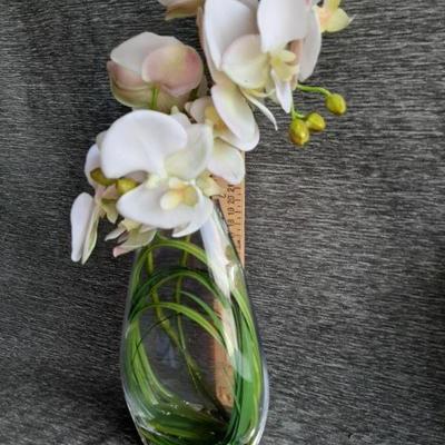 Clear vase with faux Orchids flowers