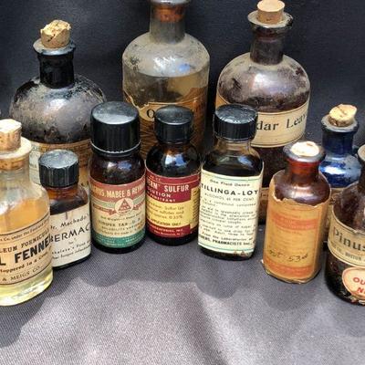 Lot #24; Mixed Lot of Amber, Blue and Clear Vintage Medical Bottles
