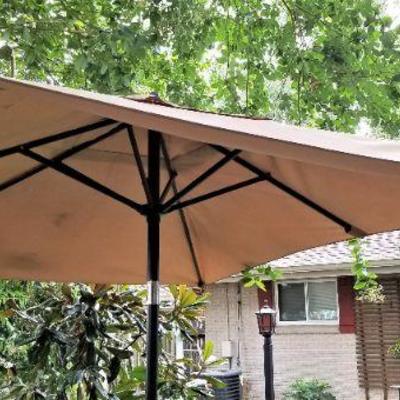 Lot #28  Retractable Market Umbrella with Stand - great condition