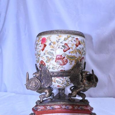 Lot 30:  Vintage Castilian Ormolu Vase flanked by three bronze griffins.
