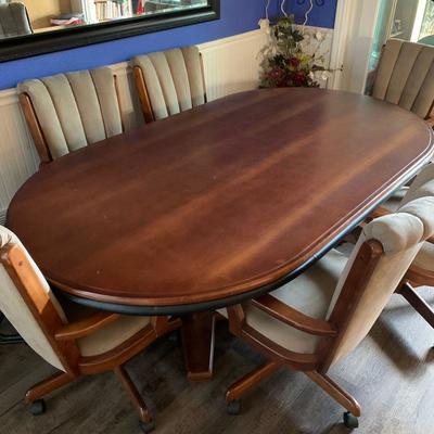 Lot 136 dining table, six chairs table is reversible with a gaming table on second side
