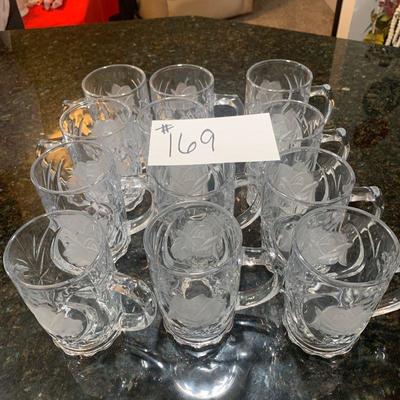 Lot 169. Set of 12 glass mugs with rose design 