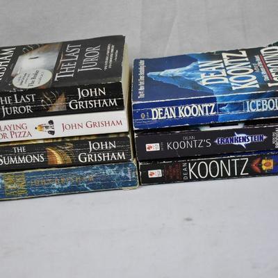 7 Paperback Fiction Books: 4 John Grisham & 3 Dean Koontz