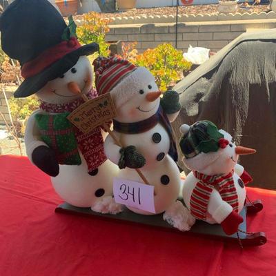Lot 341. Snowman family on sled