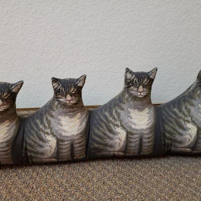 Lot 142: Descending Plush Cats