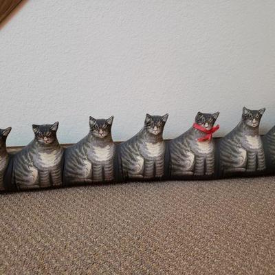 Lot 142: Descending Plush Cats