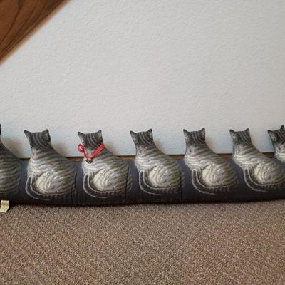 Lot 142: Descending Plush Cats