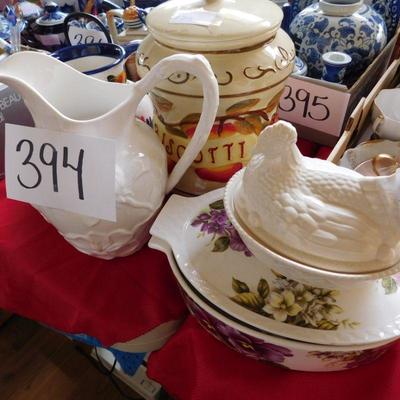 Lot 394 biscotti jar, two pitchers and a chicken dish