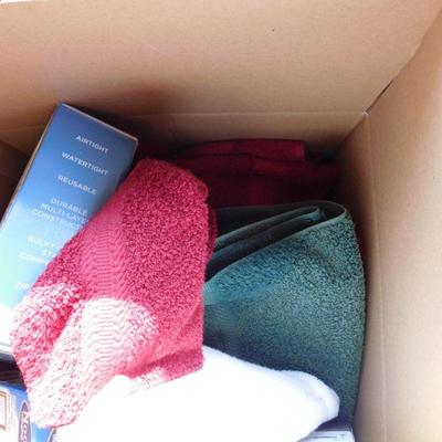 Lot 413 box with six towels two compression bags for storage of linens and clothing