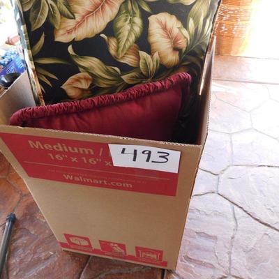 Lot 493 patio cushion and three miscellaneous pillows