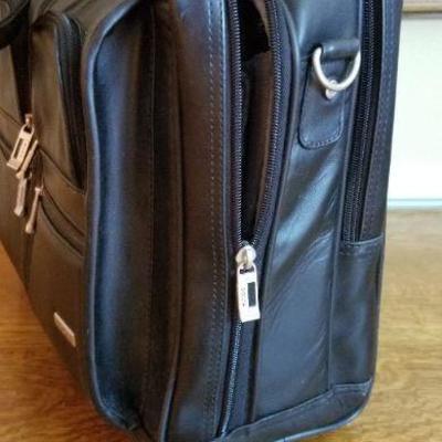 LOT # 187: SOLO Black Leather Travel Bag