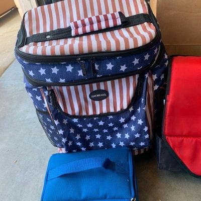 Lot 784 igloo soft sided ice chest, red white and blue rolling cooler and small soft cooler