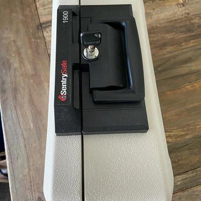 SENTRY SAFE WITH FOB KEY for photos, cash, passports, documents.