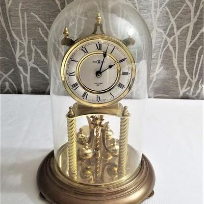 Lot #60  Howard Miller Anniversary Clock under Glass Dome