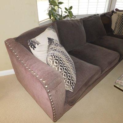 Lot 1 dark gray sectional sofa with four decorative pillows