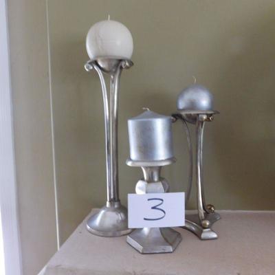 Lot three candles and candle sticks