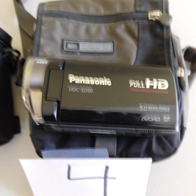 Lot 4 camera bags and a Panasonic HDCSD 90 video camera