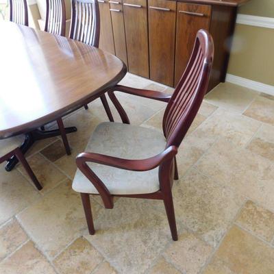 Item 30 Danish more modern dining set with two arm chairs and six side chairs length is 82 depth 40 inches